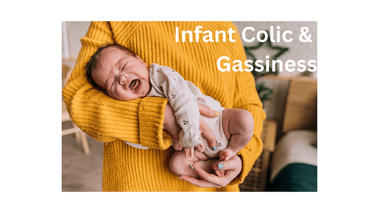 "Parent in a mustard yellow sweater holding a crying newborn baby in a side-lying position, illustrating infant colic and gassiness."